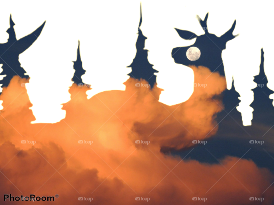 silhouette of deer and trees with orange clouds and moon background