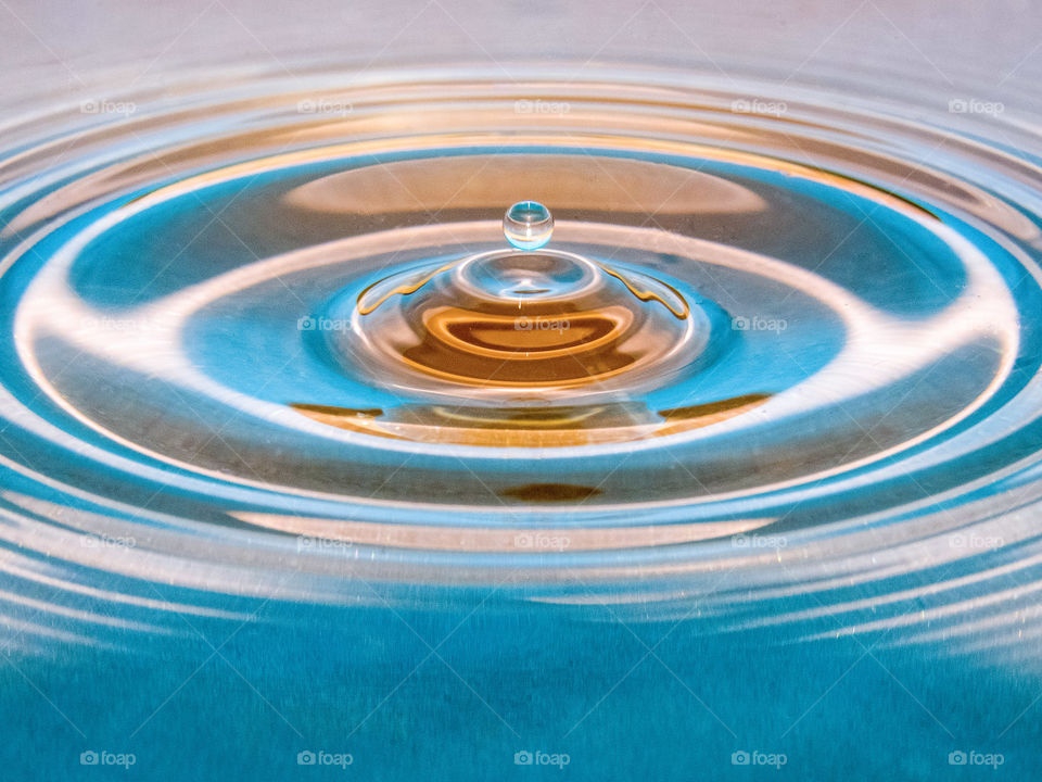 Waterdrop on a blue and orange background