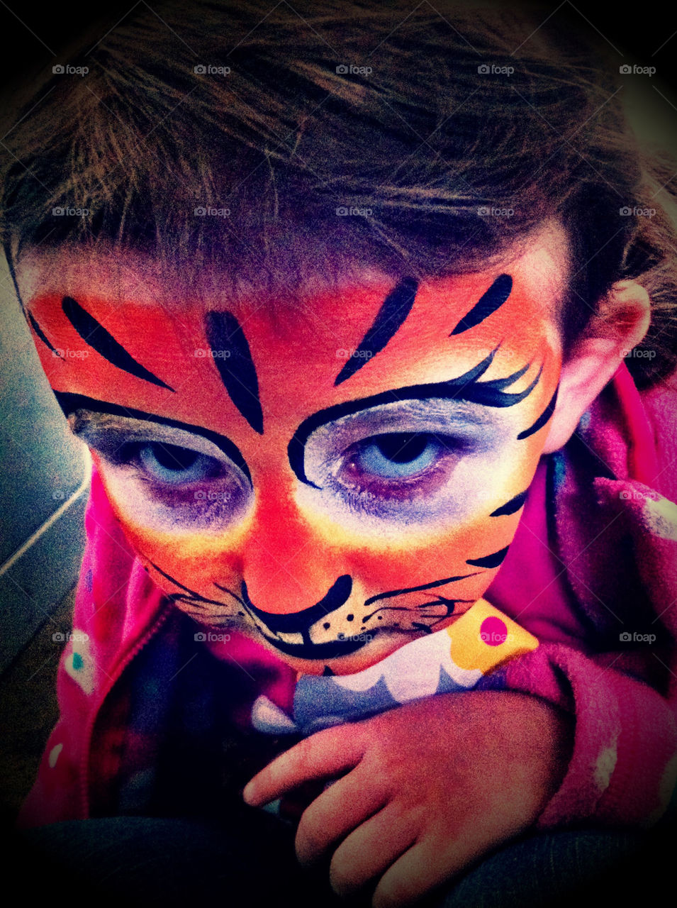 Grumpy little girl with face paint