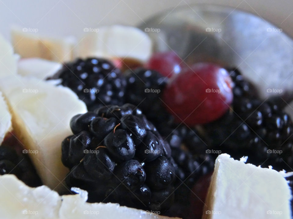 Fun fact: bananas are, in fact, berries. So yeah, we've got blackberries and, uh, "bananaberries" here folks! Grapes are berries too, meaning this fruit salad is actually just a gigantic bowl of berries. They look delicious!