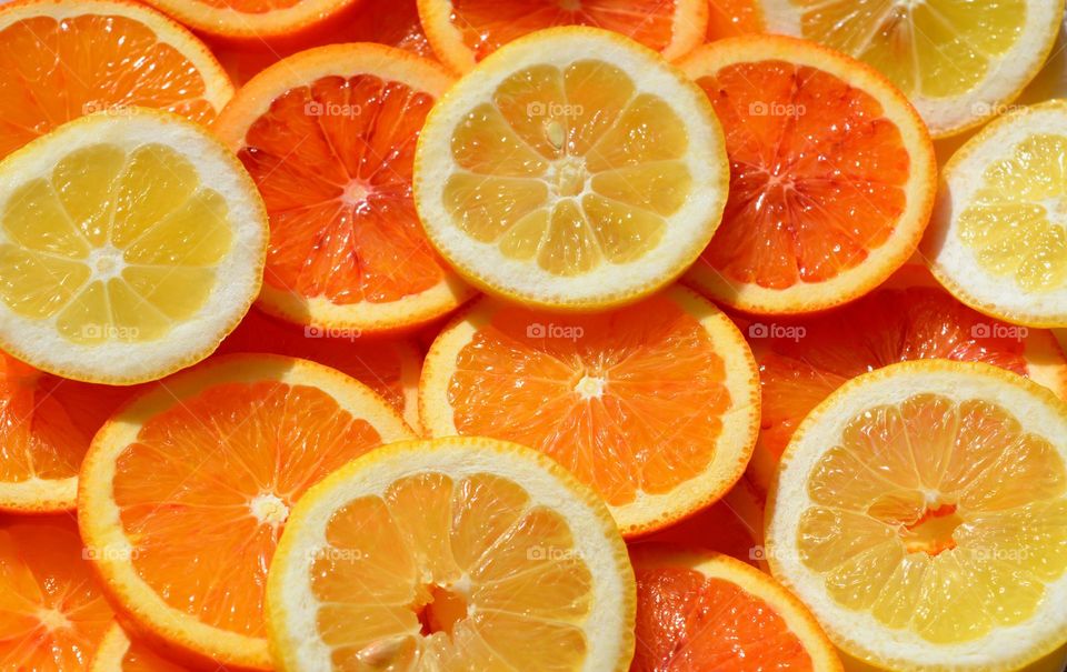 orange and lemon citrus sliced fruits beautiful texture background