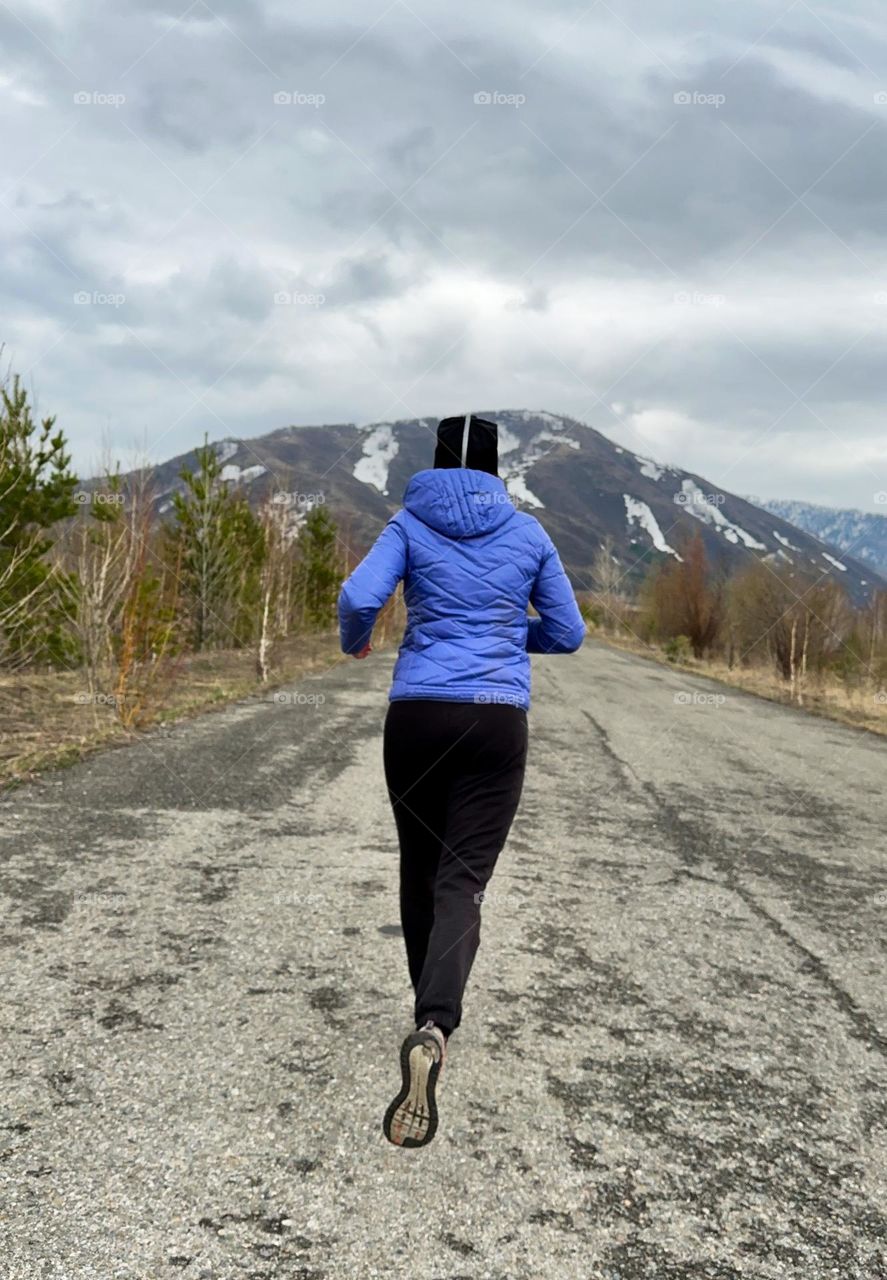 woman running on the road