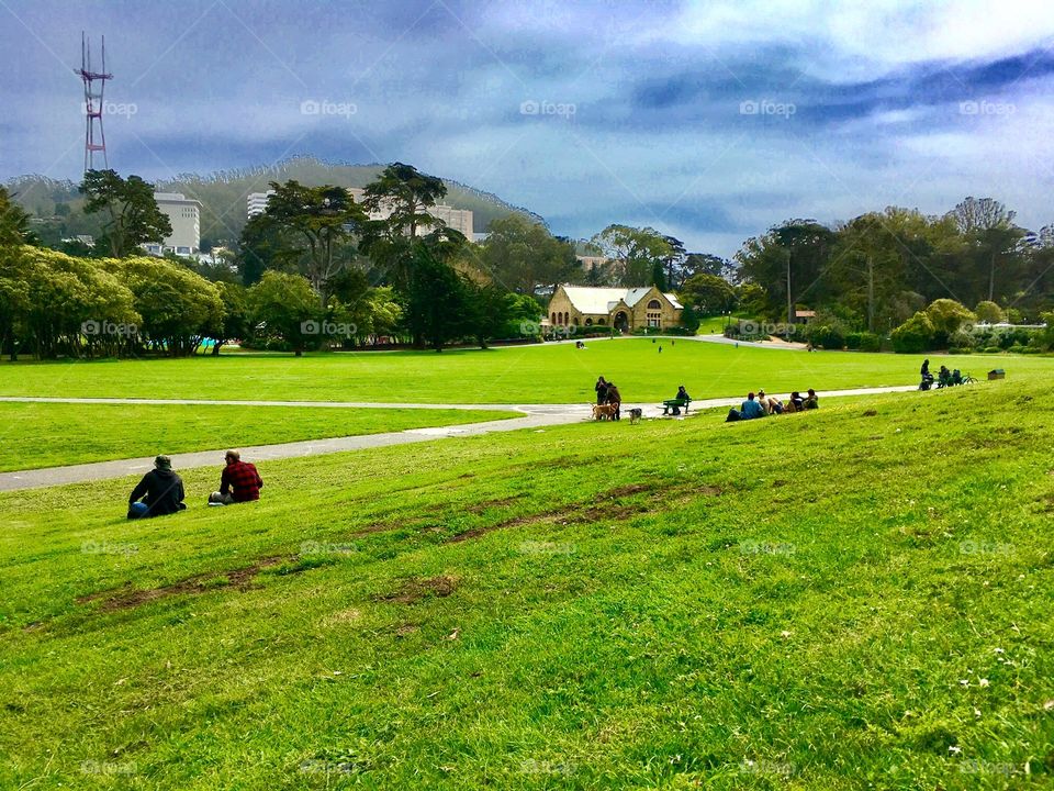 People rest on a green hillside in San Francisco’s gorgeous Golden Gate Park. This area is a favorite for hippies who like to lounge, picnic and maybe smoke a little in the middle of the day. 