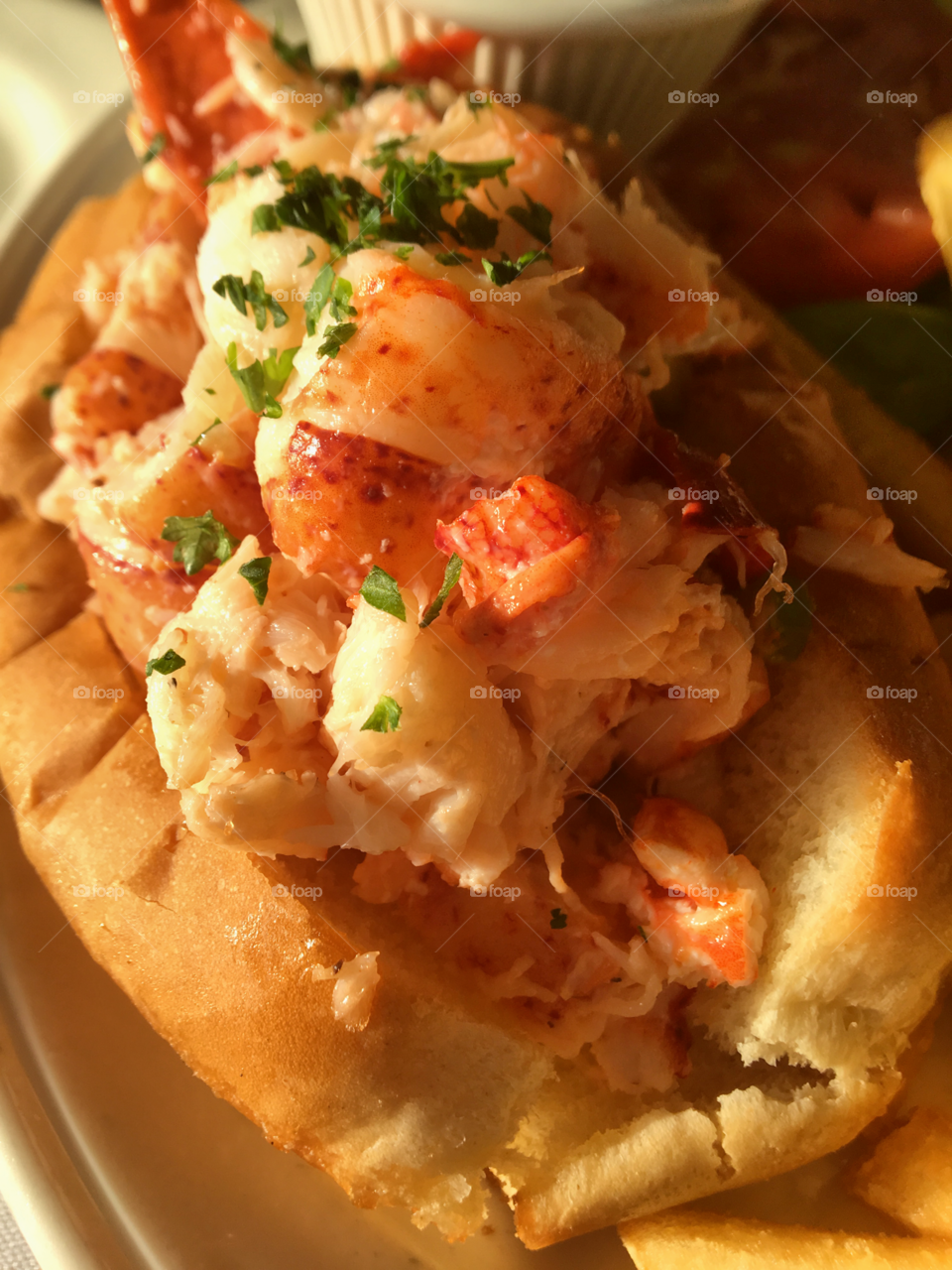 A classic lobster roll with crisp fresh pieces of lobster. 