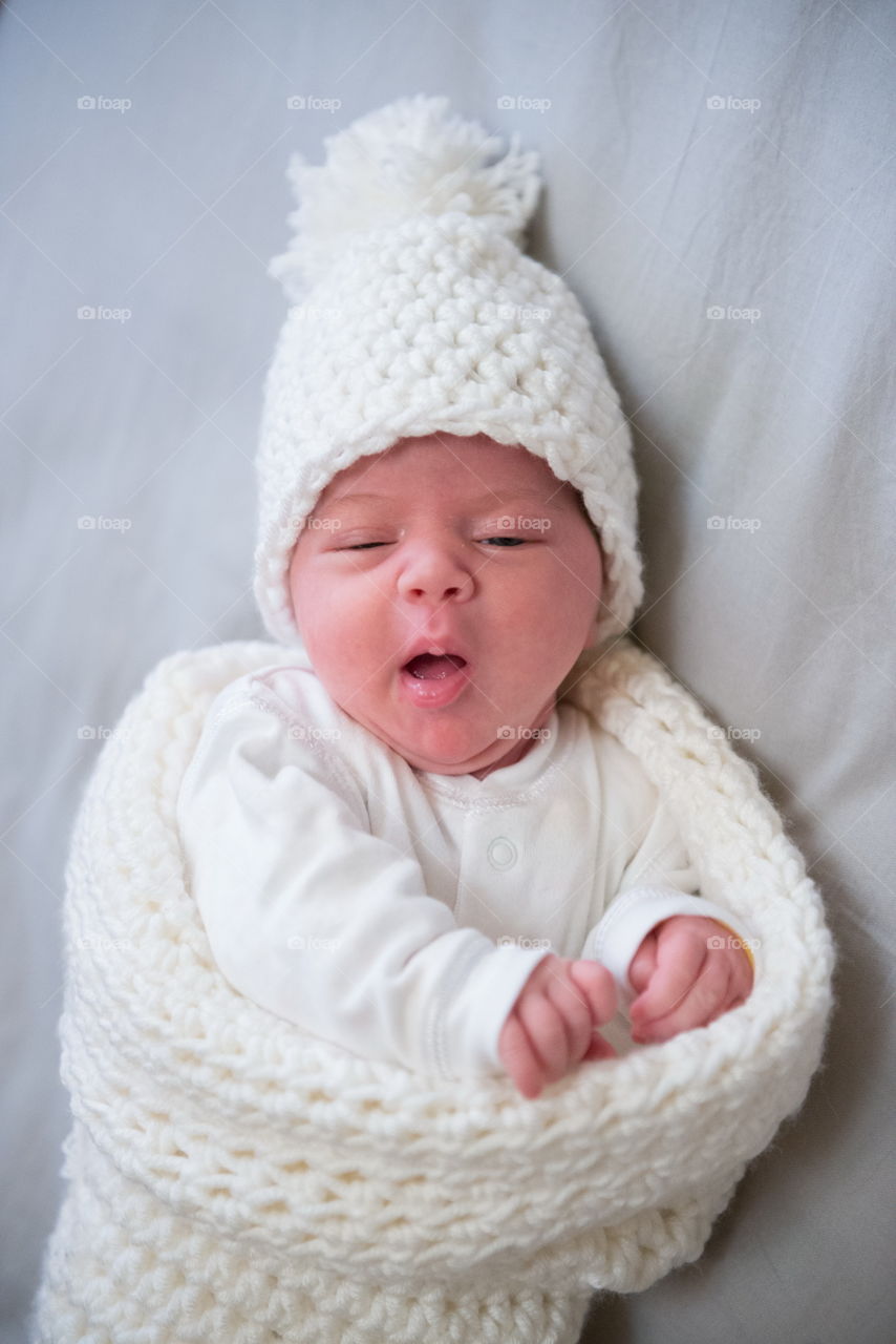 cute baby making funny face wants to sleep