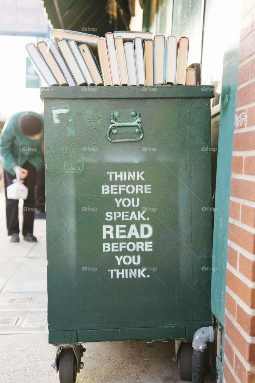 books over green trolley bin.. 💙