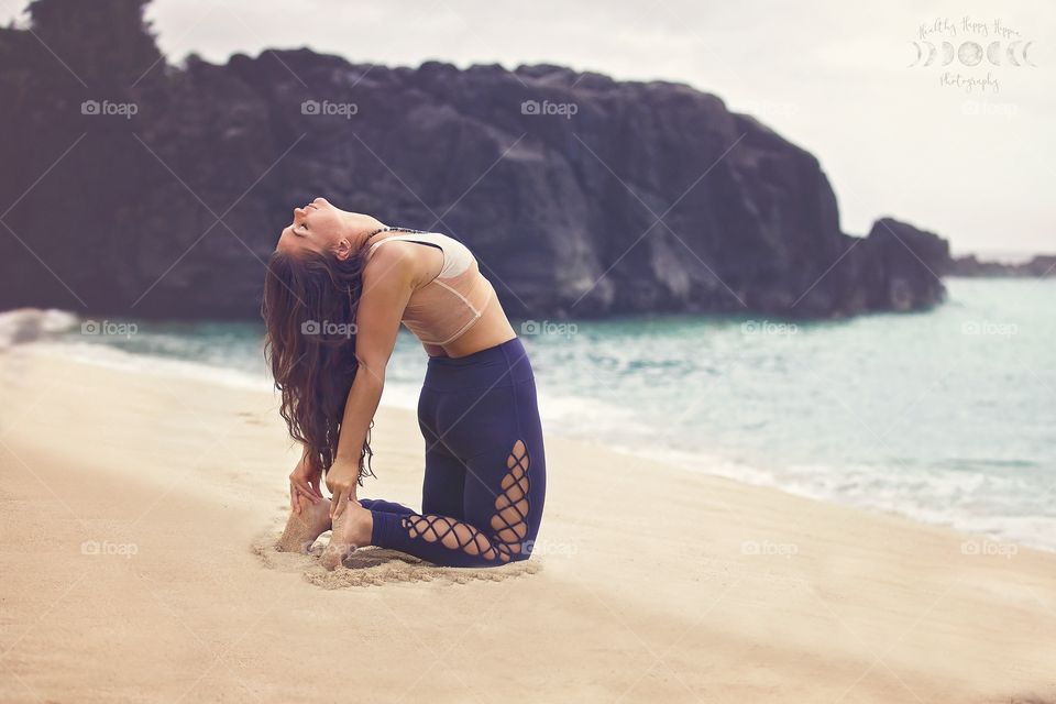 Yoga in the sand on the north shore! Beautiful Waimea bay and turquoise waters make for a relaxing spot to work camel pose 
