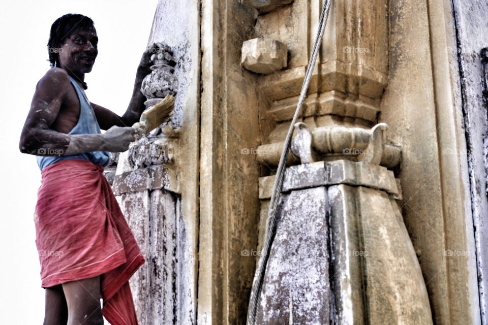 Hard at work, Varanasi Temple, India . Painter sees me and asks me to take his photo 