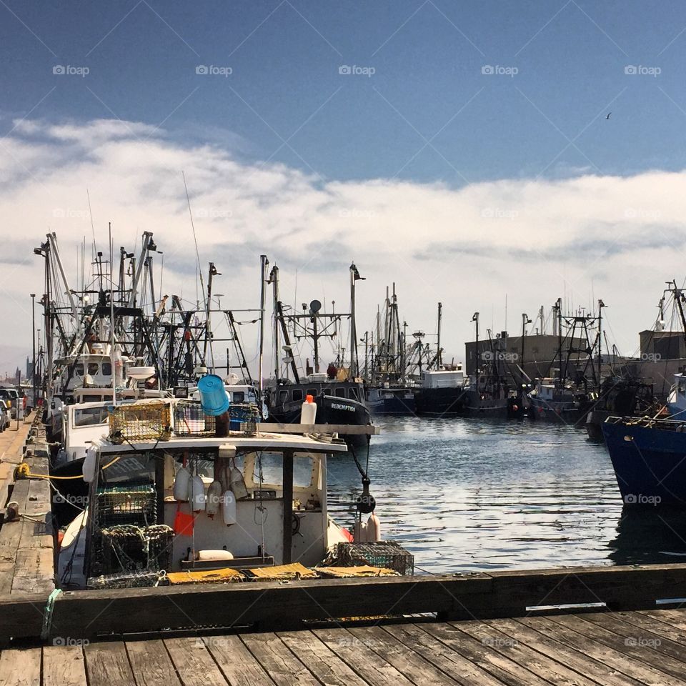 Fishermen of New Bedford. Fishing boats docked on a beautiful sunny day