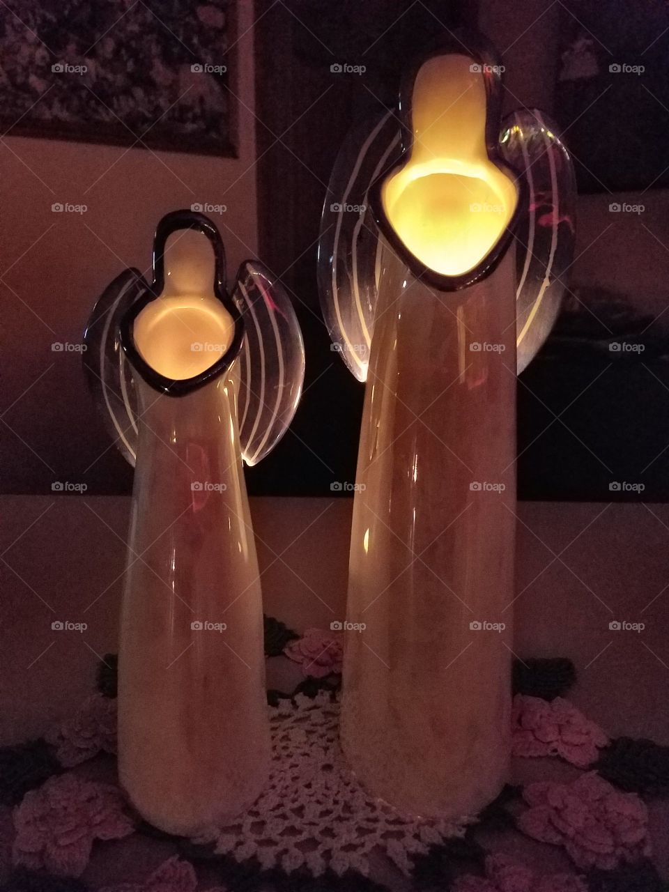 Angel candles creating soft light.