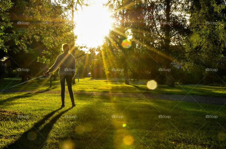 Girl standing sunset fall