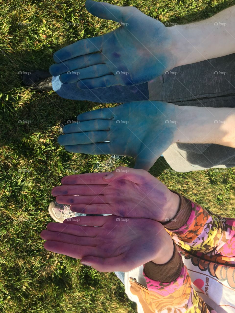 Colorful hands after a color run