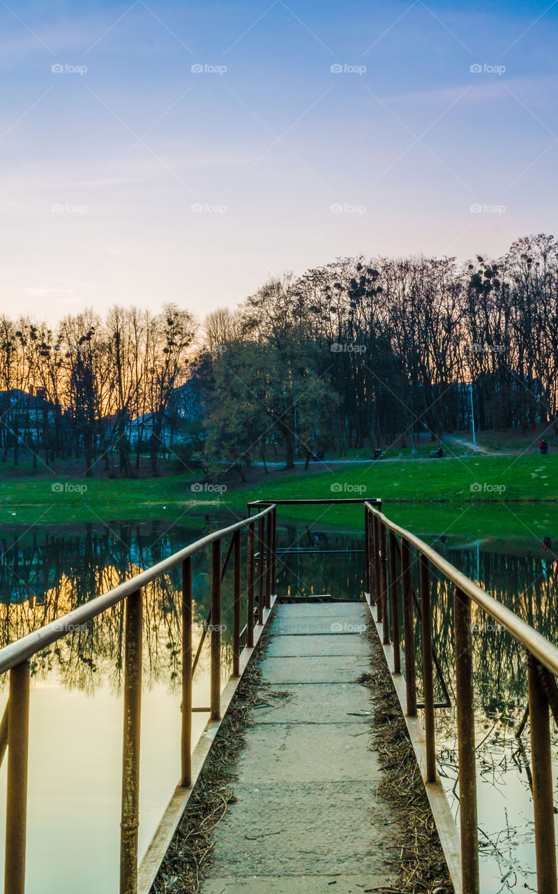 city park with lake in the spring season