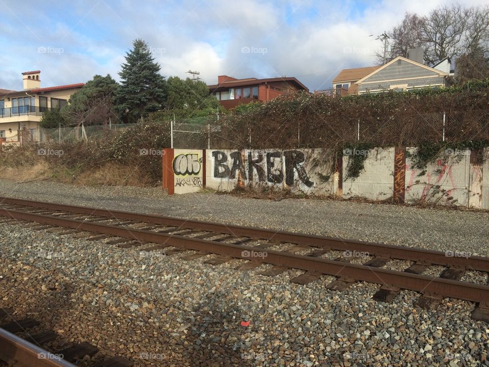 A rail road with graffiti.