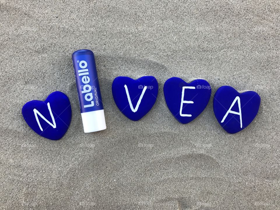Nivea and stones art work with sand background