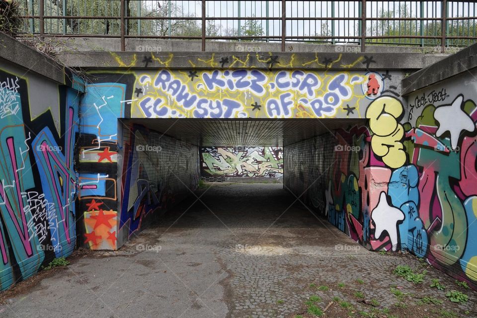 Colorful abstract graffiti and lettering on the walls of bridge and underpass near Vitkov in Prague, Zizkov.