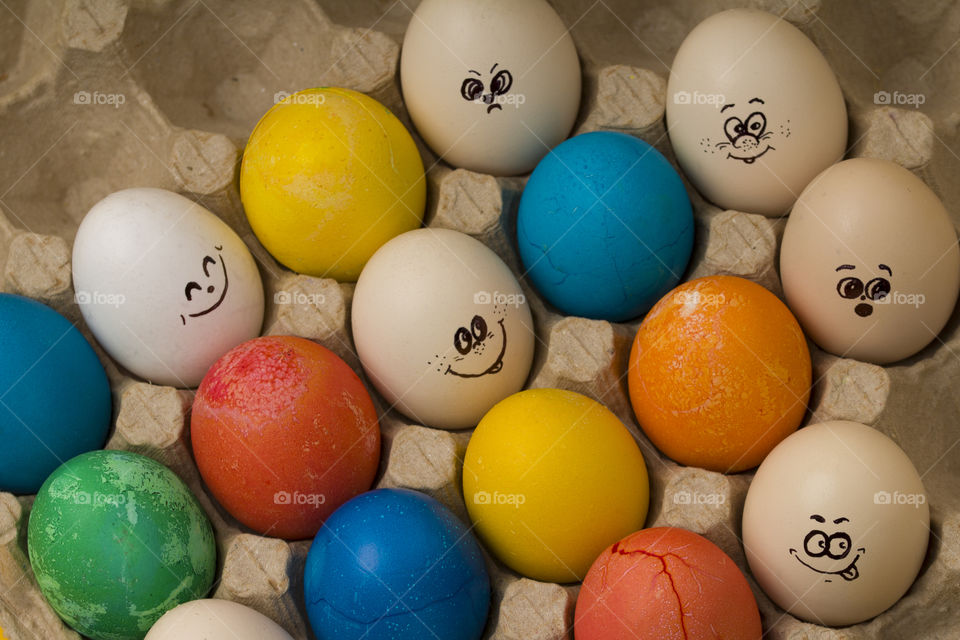 multicolored Easter eggs in cardboard.