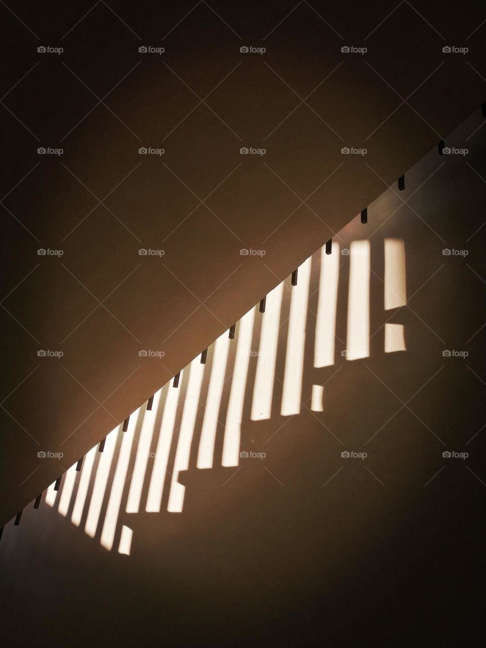 Morning sunlight falling down through the window on a industrial stairs.