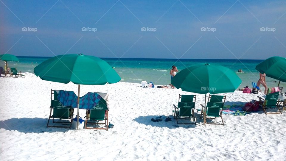 Relaxing under umbrellas on the beach