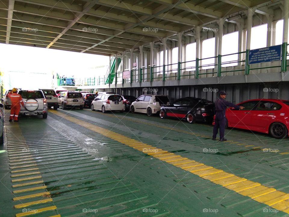 car loading into ferry,  location Labuan Island Malaysia