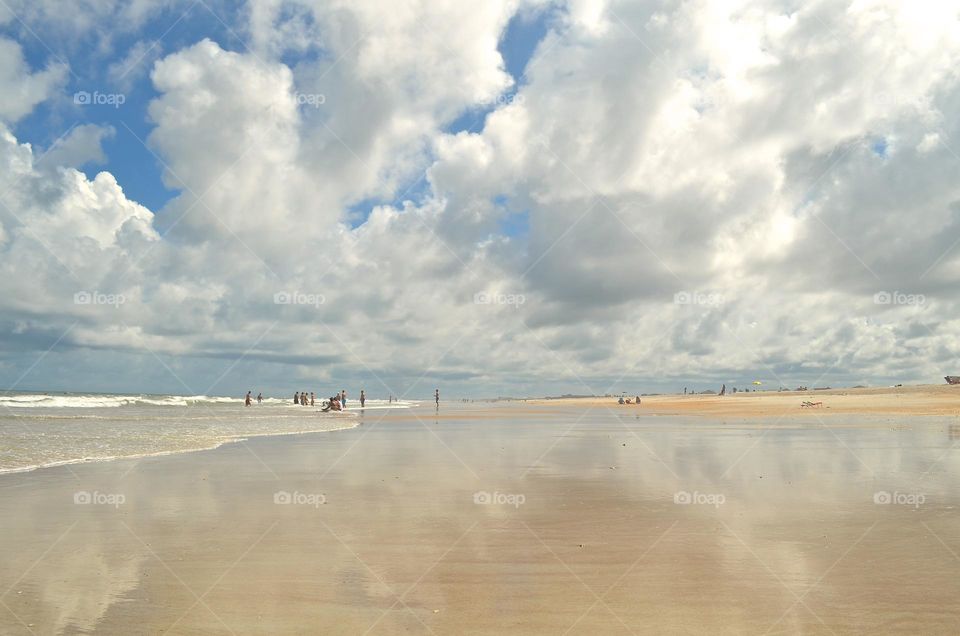 A very picturesque nature and sky reflections in the sand of the coast in St. Augustine, Florida