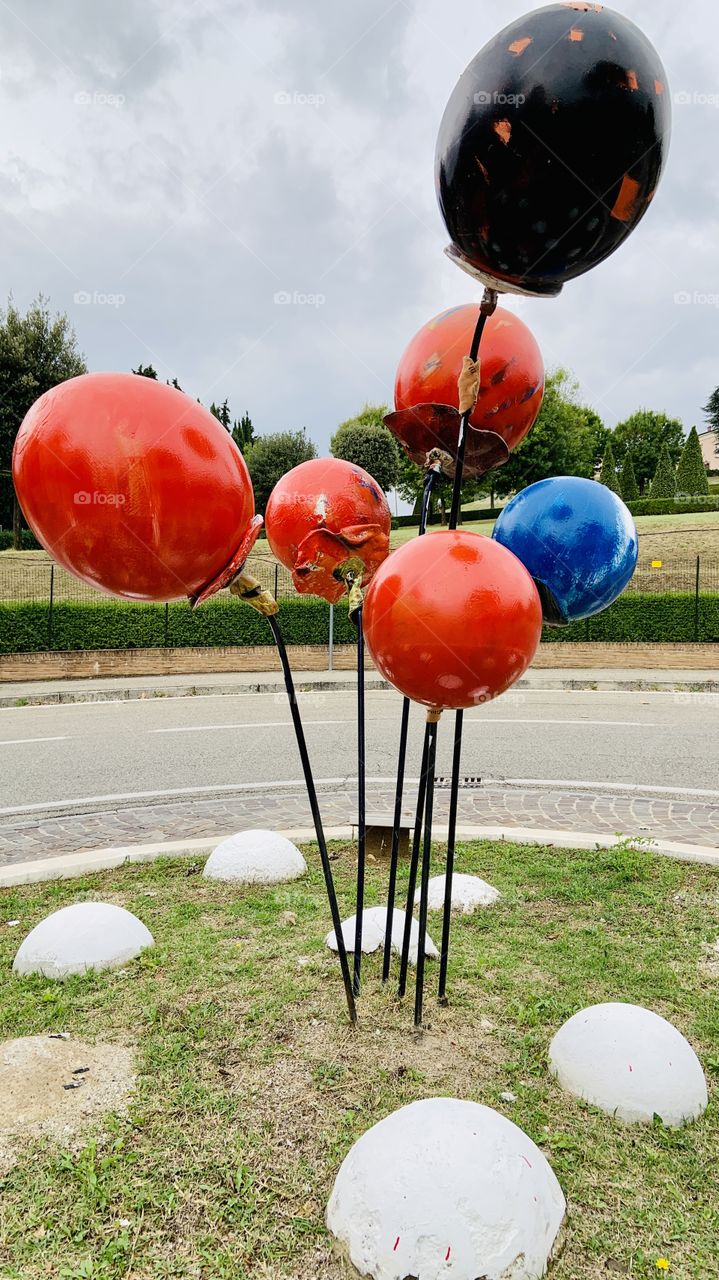 Red balloons in roundabout 