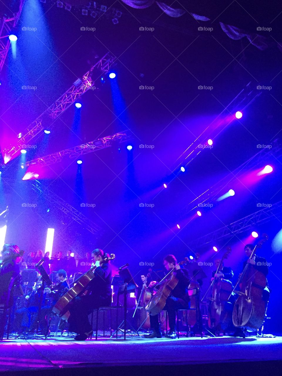 Symphonic orchestra on the stage illuminated 