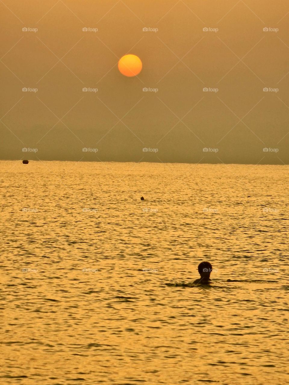 swimming at sunrise