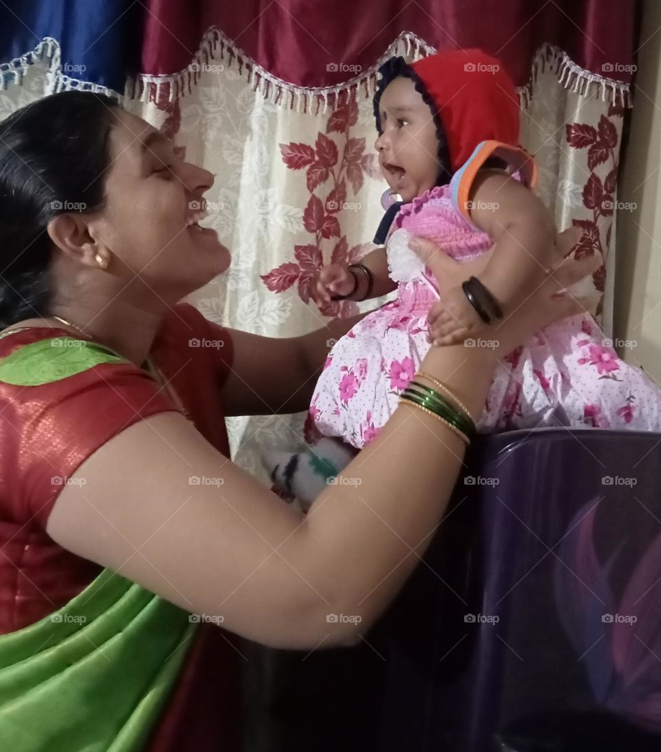 A beautiful photo 😍😘 showing mother and daughter's affection and love 💕. In this awesome photo mother and also girl baby express feelings is sooo happy, real and pure love 💕😘