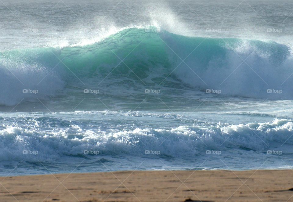 Emerald waves breaking on the golden sand...precious moments.