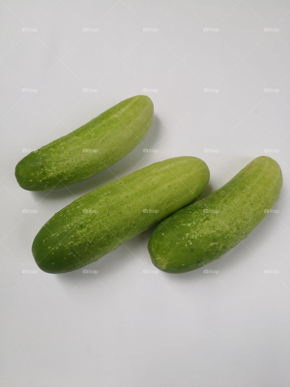 Closeup of cucumbers isolated on white background.
