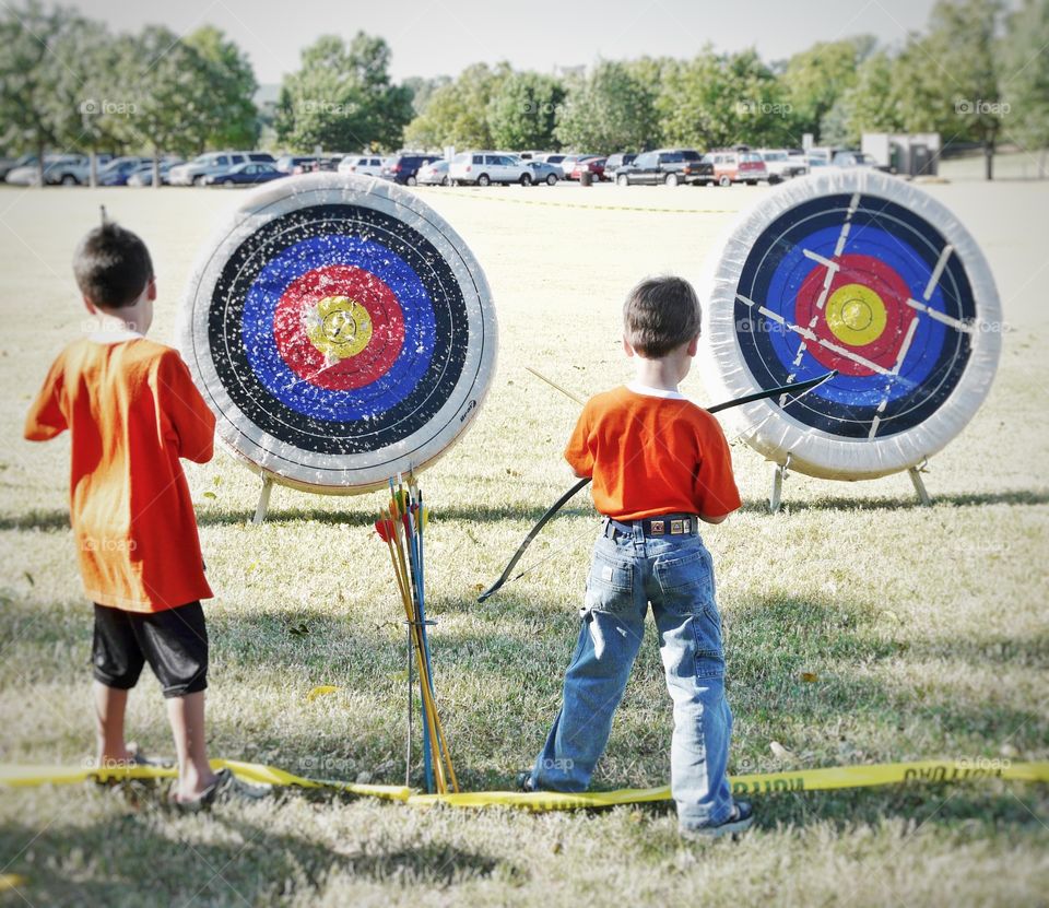 Learning archery in Cub Scouts. 