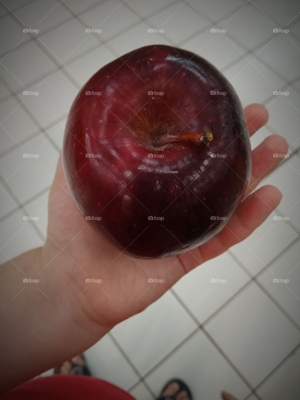 An apple in hand