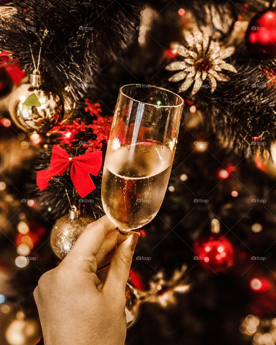 glass of champagne on background of the Christmas tree