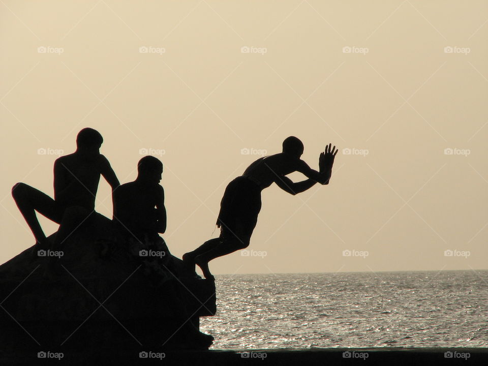 Boys playing in Malecon, Cuba 