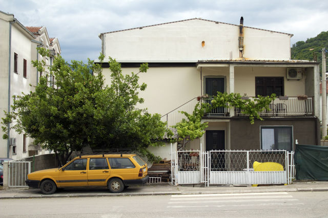 Yellow old car in the street