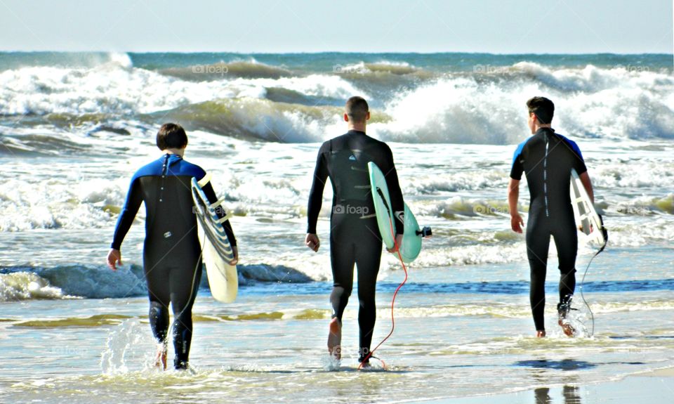 Surfers hit the wave in rather Gulf of Mexico - Elements of odds photos using that psychological condition of the human brain in order to make some really interesting and pleasant composition