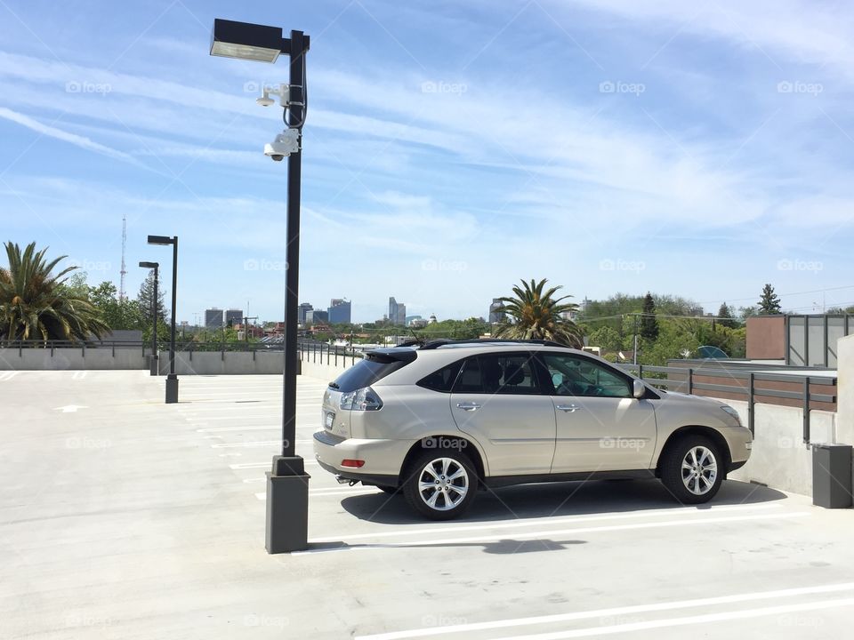 Clean Lexus SUV on an empty parking lot. 