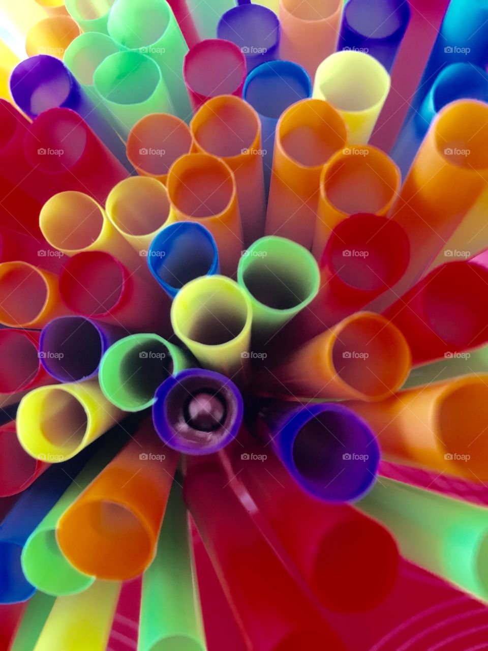 Abstract colorful bundle of drinking straws 