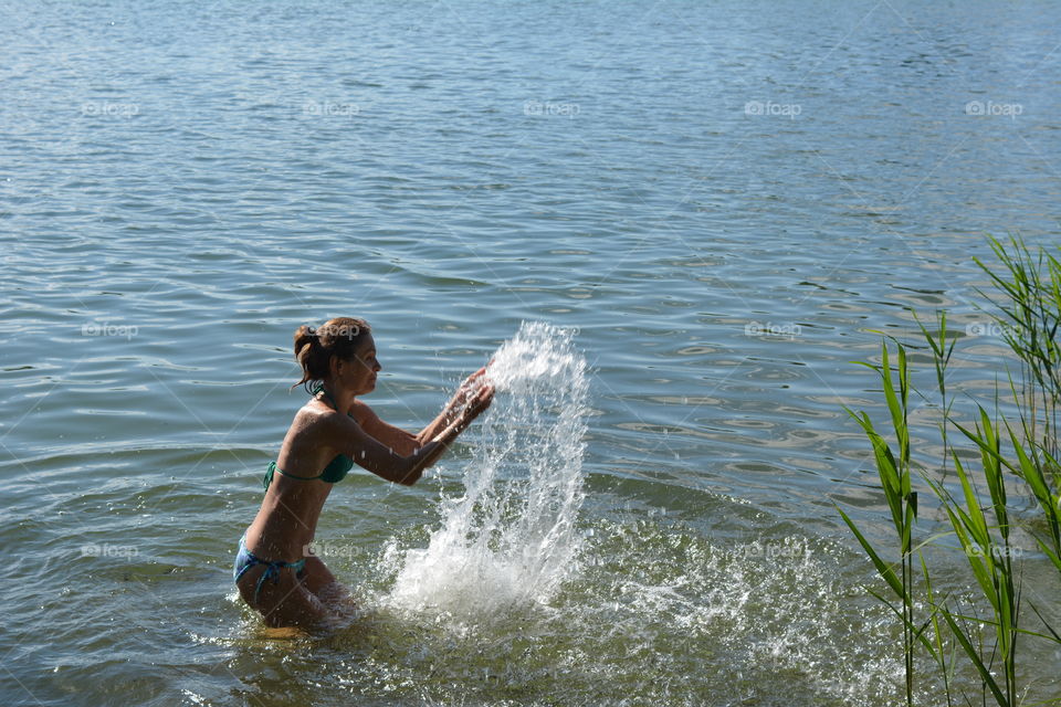 woman in the water lake summer heat, summer vacation