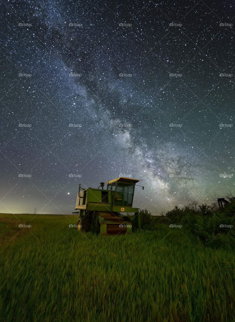 farm tractor at night under the stars