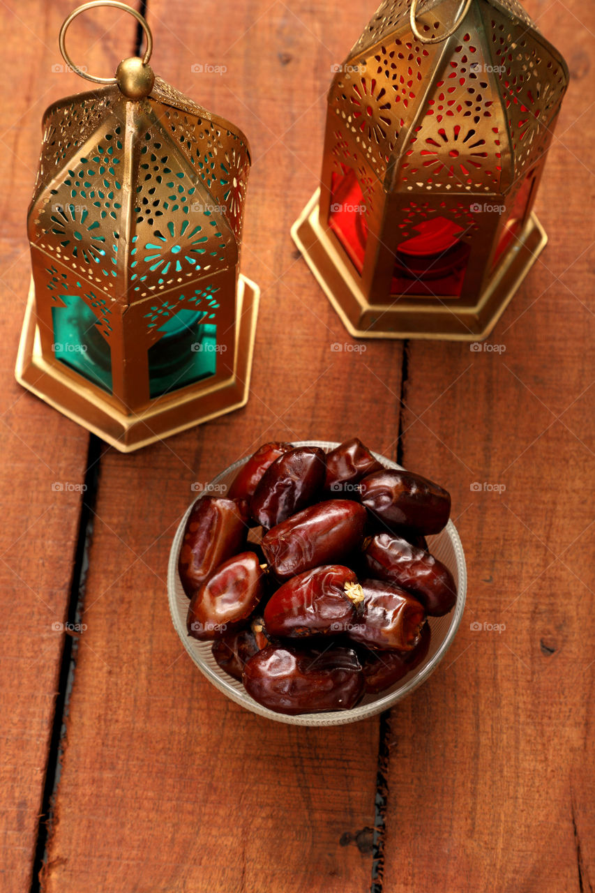 Dates fruit in a bowl with lantern
