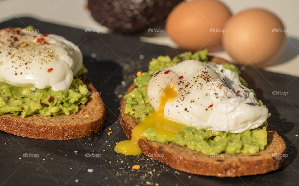 Poached eggs on smashed avocado on toast