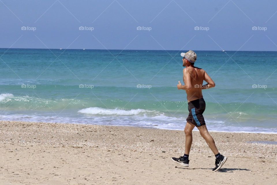 Man running at the beach