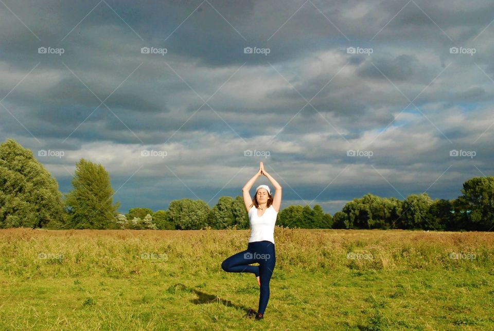 girl doing yoga in nature