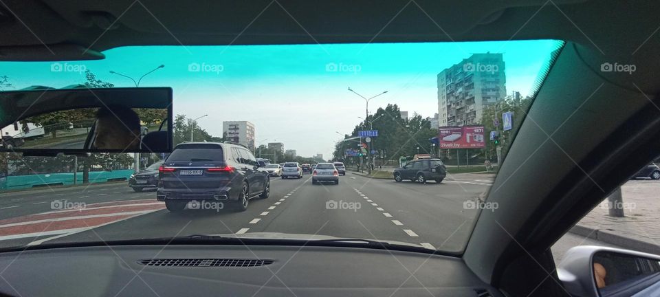 driver in car road window view summer time