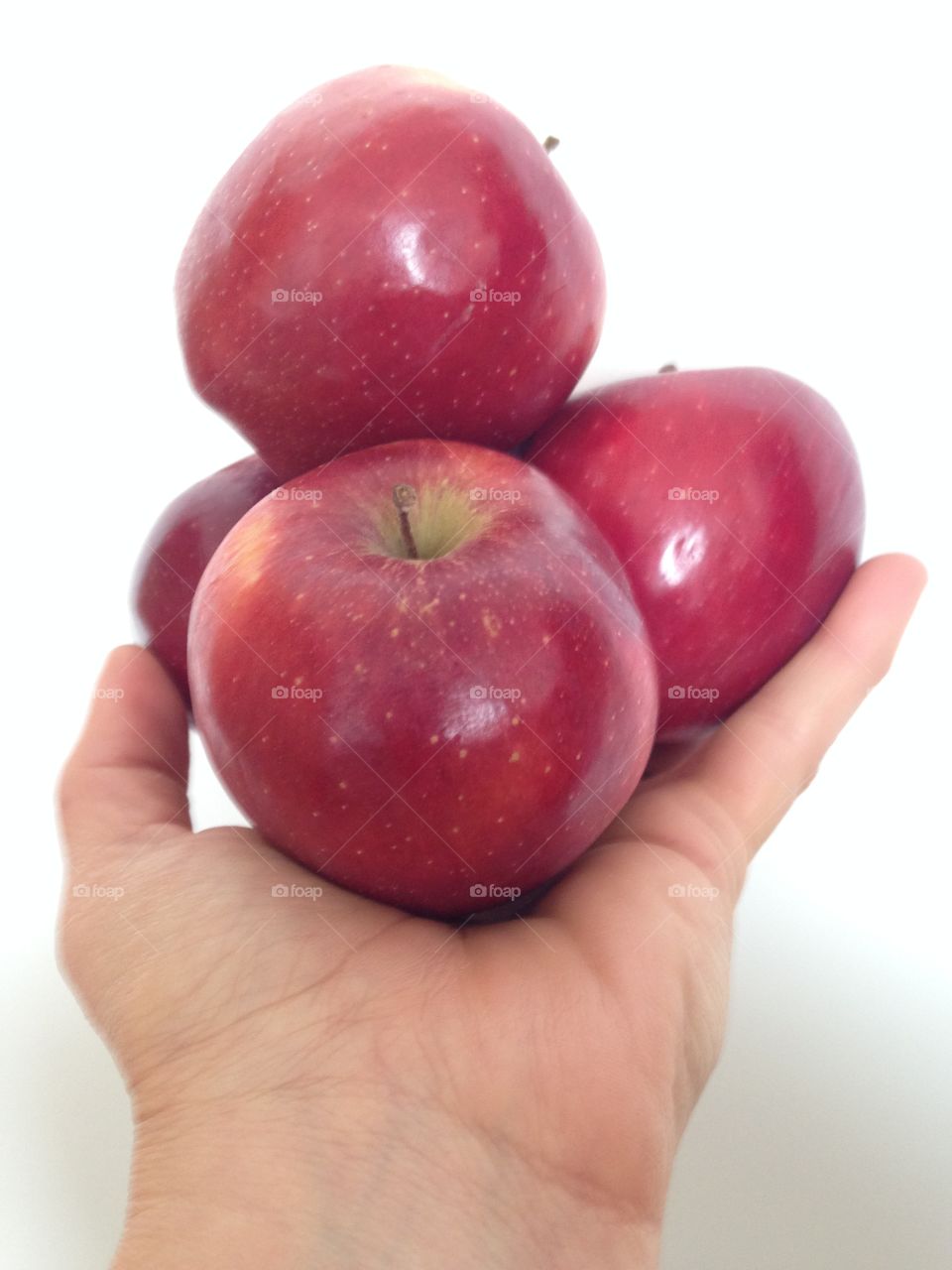 Holding red delicious apples 