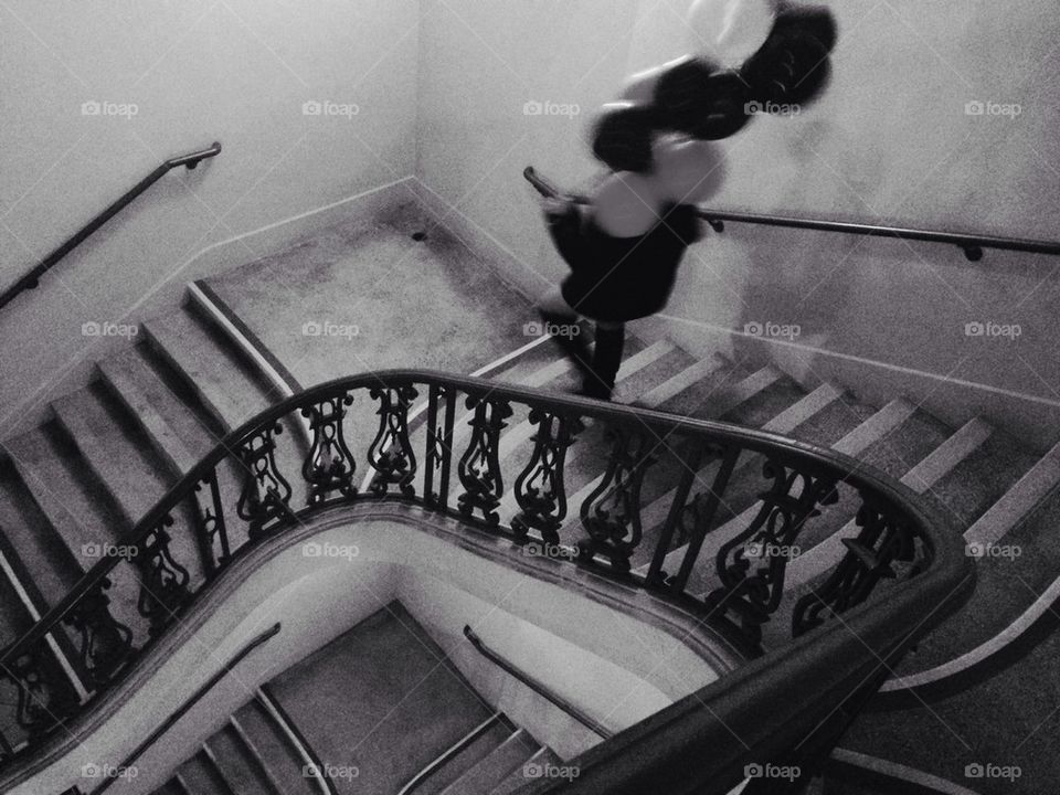 Woman with balloons on stairs