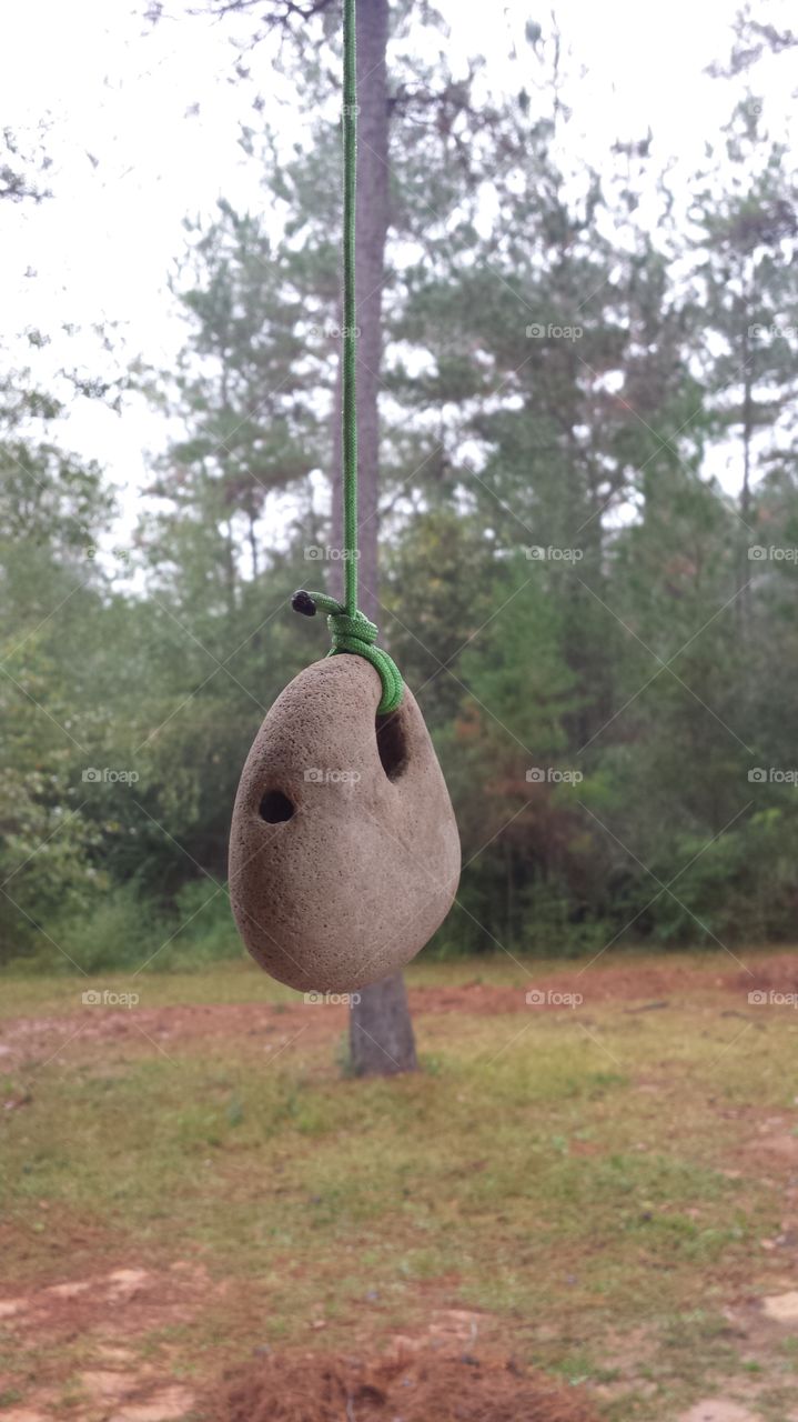 Weather rock. Old joke... rock wet, it's rain... rock dry, it's not rain...  rock swinging, it's windy... rock white, it's snow.