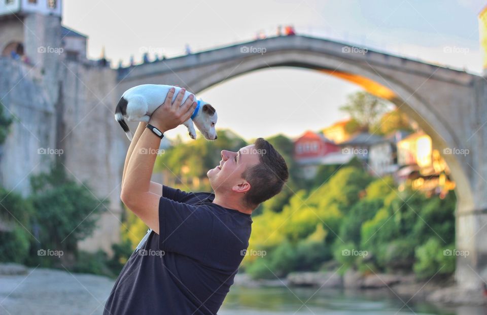 Man playing with his pet dog